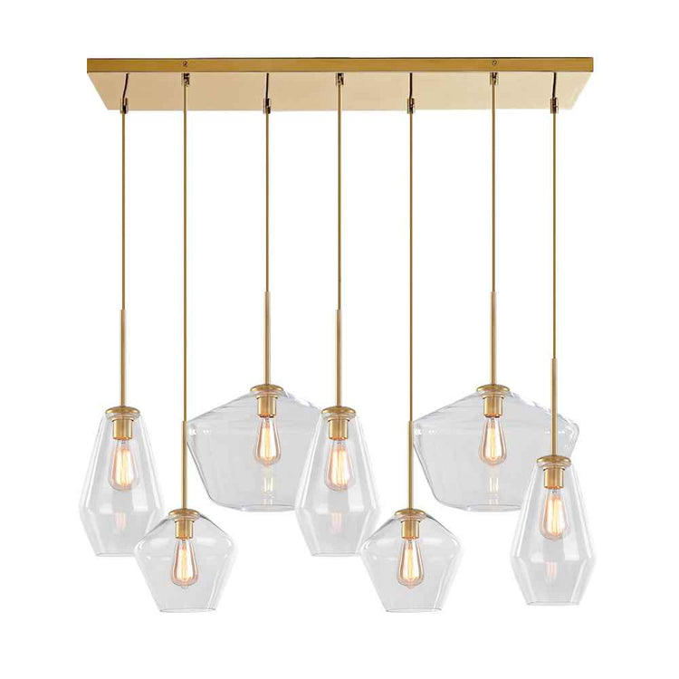 Suspension au plafond avec 7 abat-jours en verre transparent géométrique, finitions dorées.