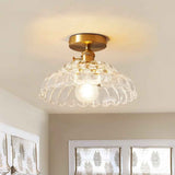 Plafonnier 1 lumière au plafond, dôme en verre transparent à motif lotus, armature dorée.