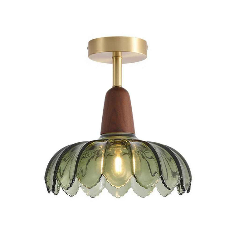 Plafonnier à dôme en verre vert translucide, base ronde laiton et tige en bois.
