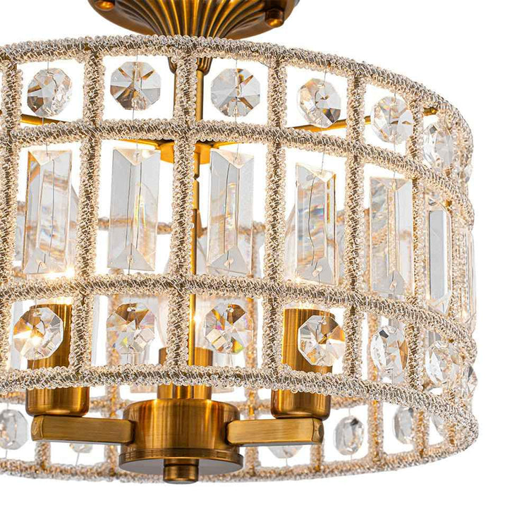 Plafonnier tambour en cristal, panneaux en relief et monture en laiton.