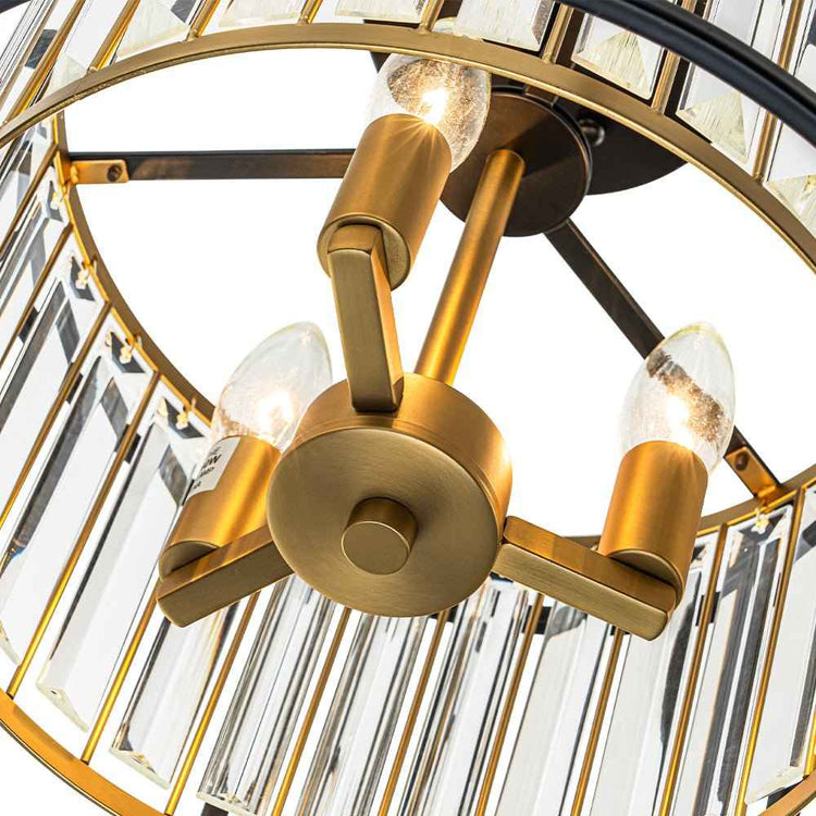 Plafonnier noir et laiton: fixation centrale ronde avec bras et ampoules en verre.