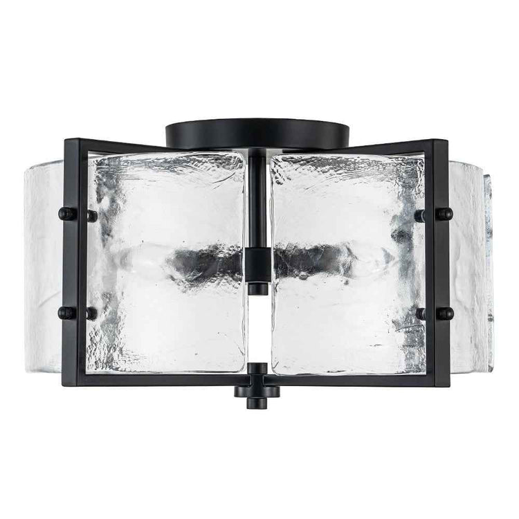 Plafonnier noir à 4 lumières avec capuchon supérieur et verre transparent texturé.