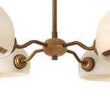 Lustre sputnik 4 lumières laiton, abat-jours en verre opale et bras torsadés