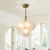 Suspension en boules opale blanc texturé sur tige laiton et platine ronde