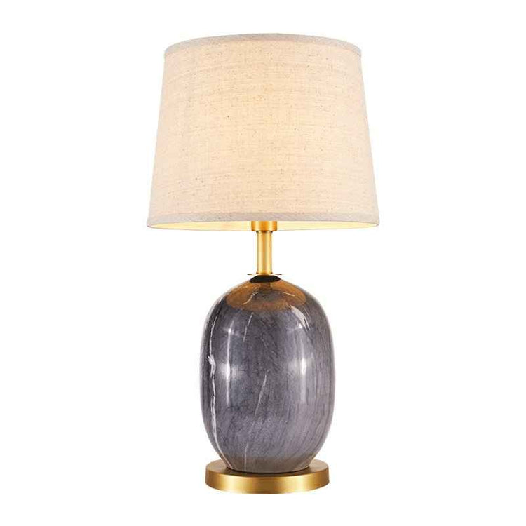 Lampe à poser en céramique gris foncé avec abat-jour en tissu beige et pied laiton