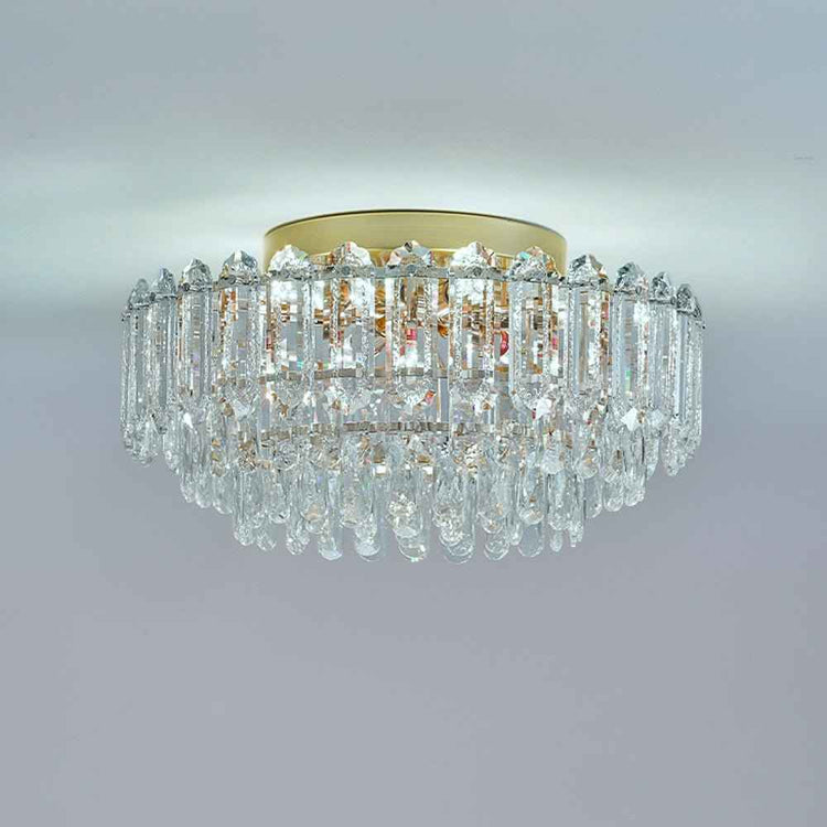 Plafonnier en cristal transparent, structure dorée et gouttes pendantes