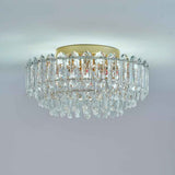 Plafonnier en cristal transparent, structure dorée et gouttes pendantes