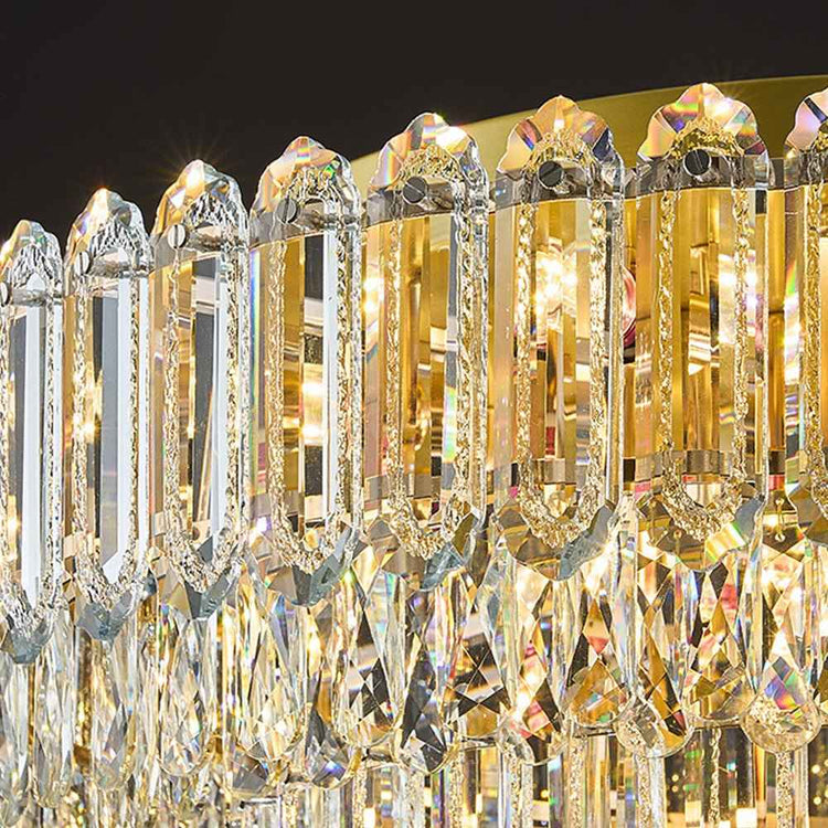 Plafonnier en cristal transparent avec monture dorée et longues gouttes