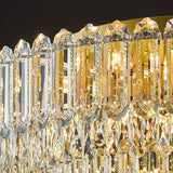 Plafonnier en cristal transparent avec monture dorée et longues gouttes