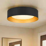 Plafonnier LED tambour noir avec verre laiteux, éclairage doux vers le bas.