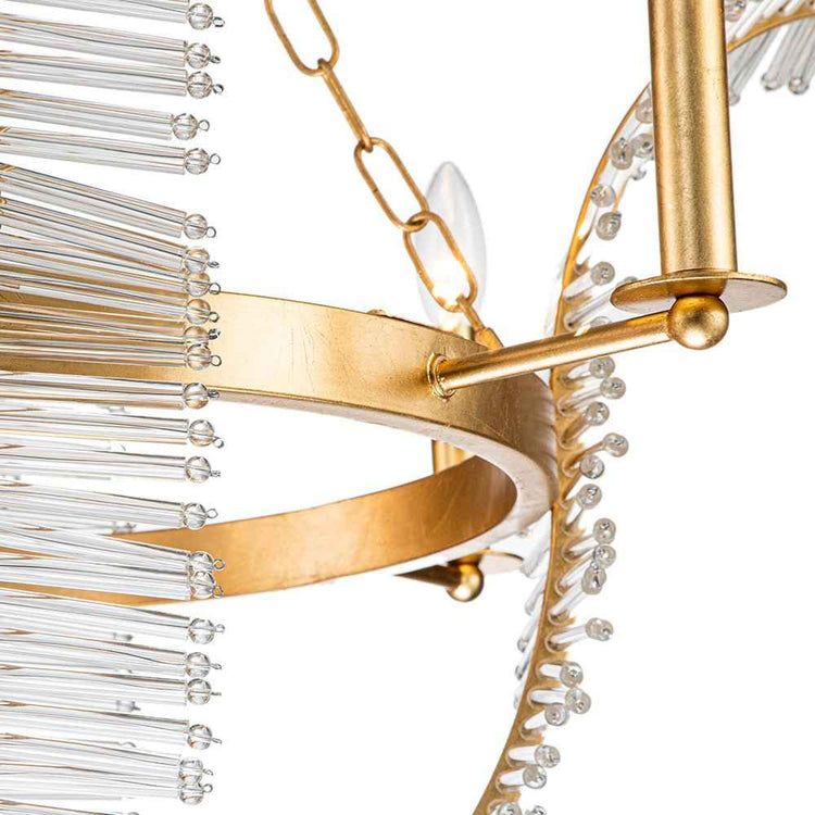Anneau et bras dorés avec ampoules et aiguilles de cristal transparent
