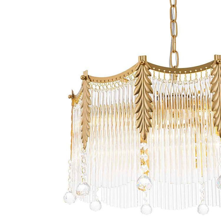 Lustre goutte de cristal : bordure dorée, feuilles décoratives et longues franges transparentes