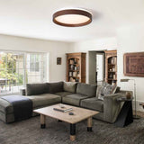 Plafonnier LED rond à effet bois, bord brun et diffuseur blanc allumé.