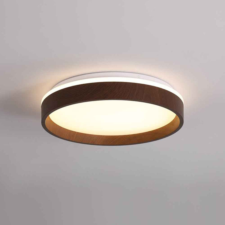 Plafonnier LED rond effet bois, anneau brun, diffuseur blanc allumé.