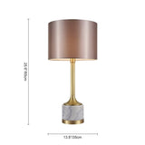 Lampe à poser : abat-jour en tissu cylindrique, base marbre claire et tige laiton.