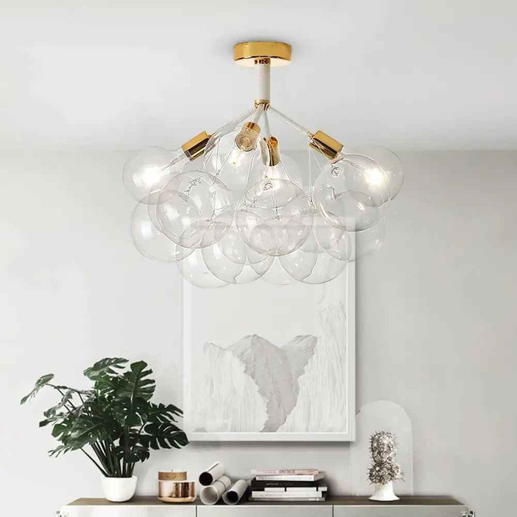 Lustre semi-encastré : tige noire et finitions dorées, globes en verre transparents