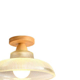 Plafonnier proche : coupole en verre transparent côtelé et socle en bois clair