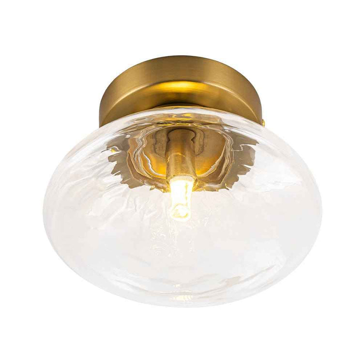 Plafonnier ovale en verre transparent avec monture laiton, ampoule à filament visible.