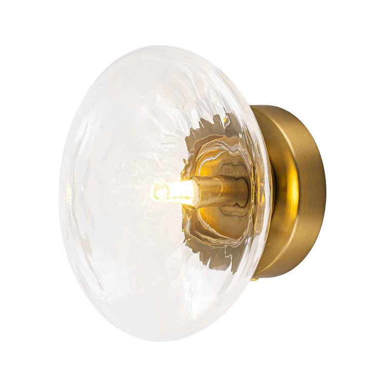 Plafonnier ovale en verre transparent avec monture laiton, ampoule et intérieur visibles.