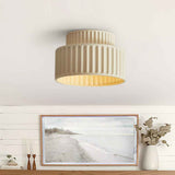 Plafonnier en céramique beige clair à double abat-jour strié, diffuseur circulaire