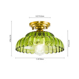 Plafonnier dôme en verre vert, dimensions indiquées: 30 cm et hauteur 16,5 cm.