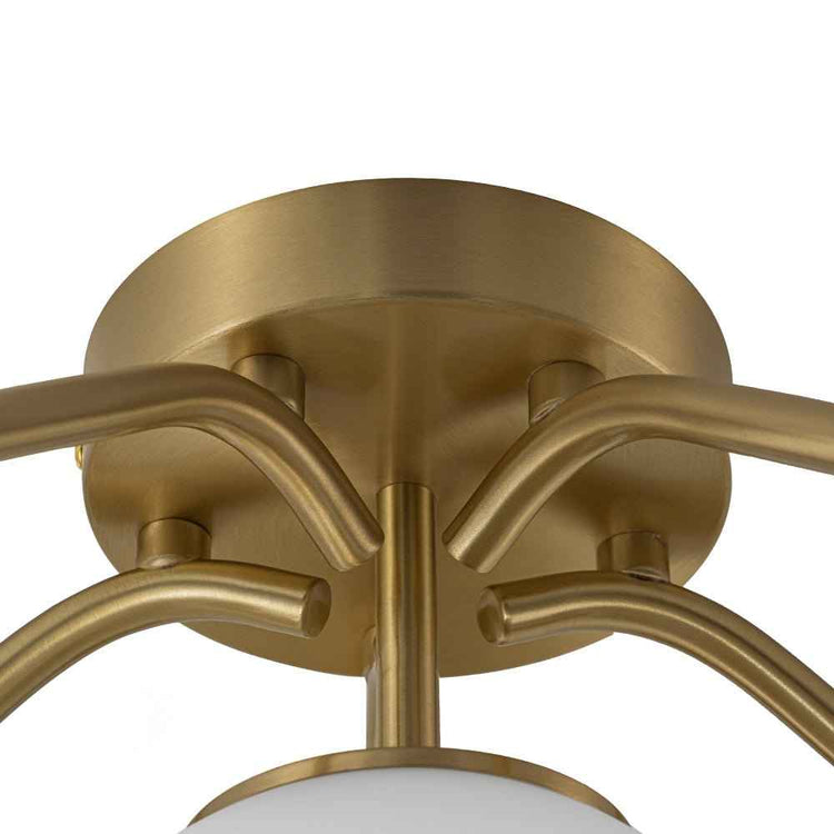 Lustre semi-encastré rosace dorée et bras métalliques, boules en verre opale