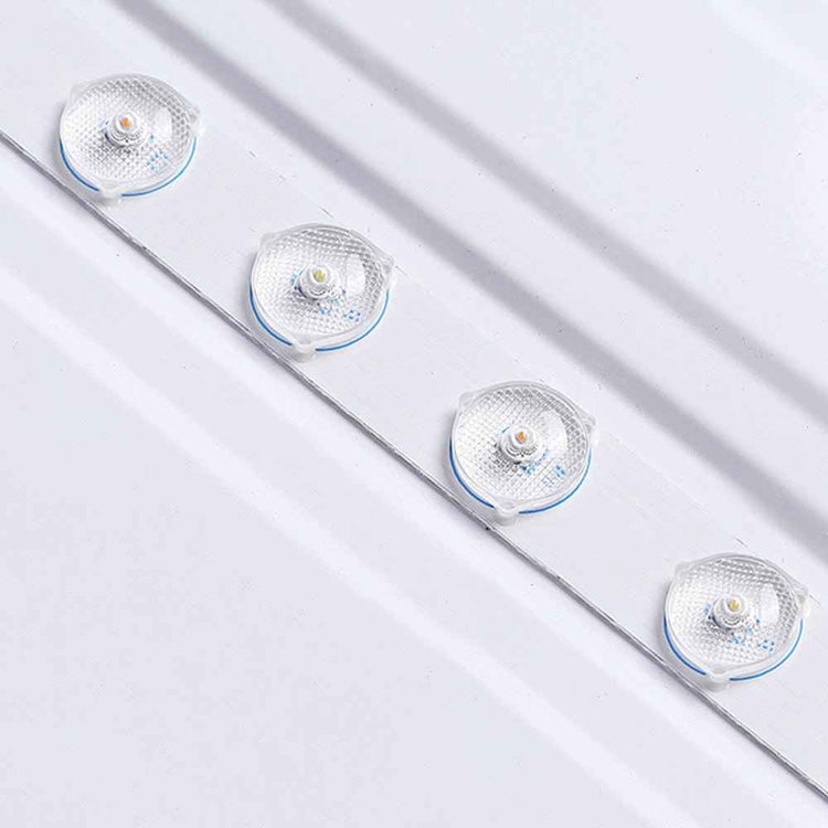 Plafonnier linéaire avec 4 modules LED ronds et verres clairs